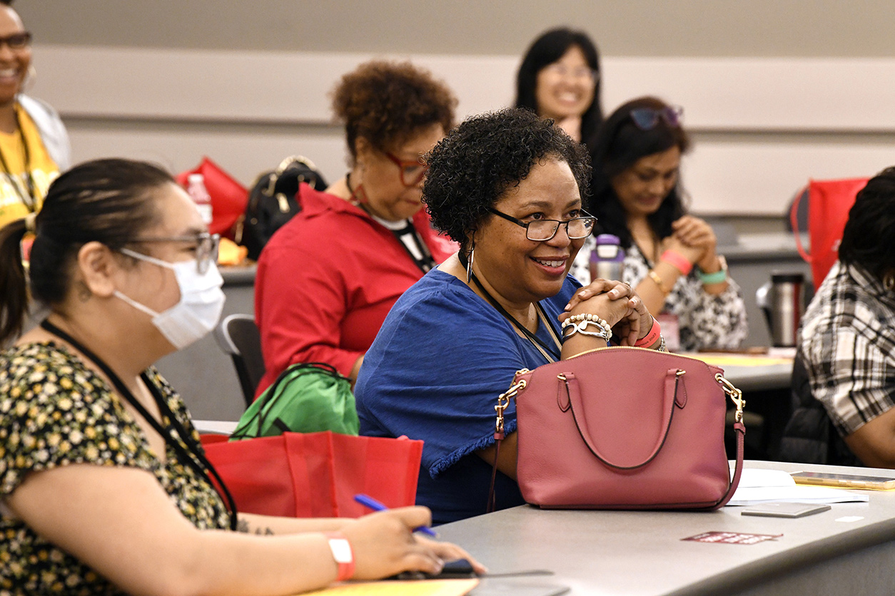 Women sitting in the audience at the conference
