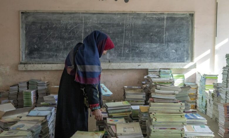 wrd afghanistan teacher collects books.jpg
