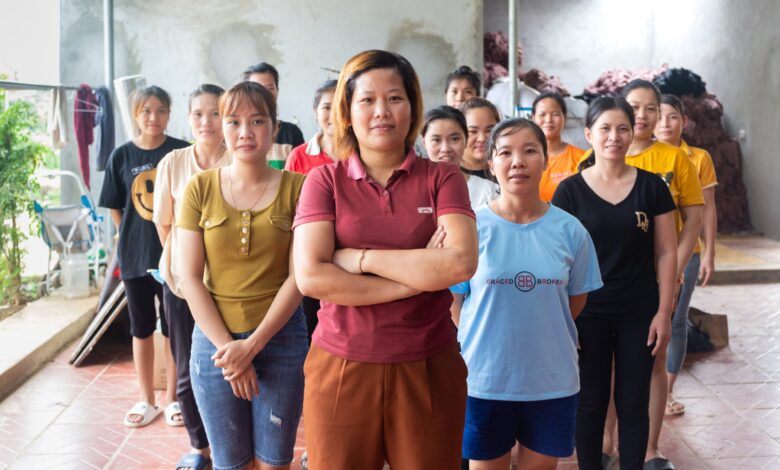 Bich portrait outside with staff IGNITE scaled.jpg