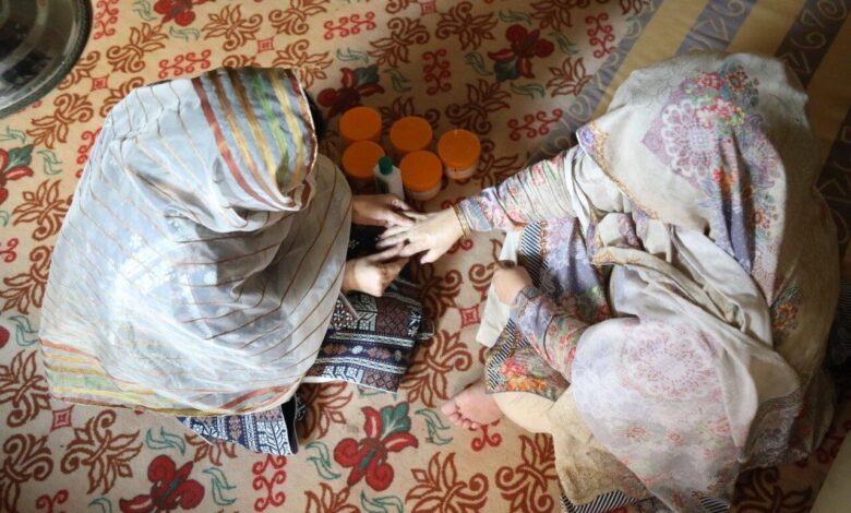 Nida offers beauty tips to her new clients after taking a beautician course supported by UNHCR. x.jpg