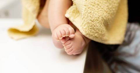 close up baby legs with yellow towel .jpg