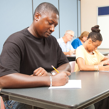 people testing in a classroom