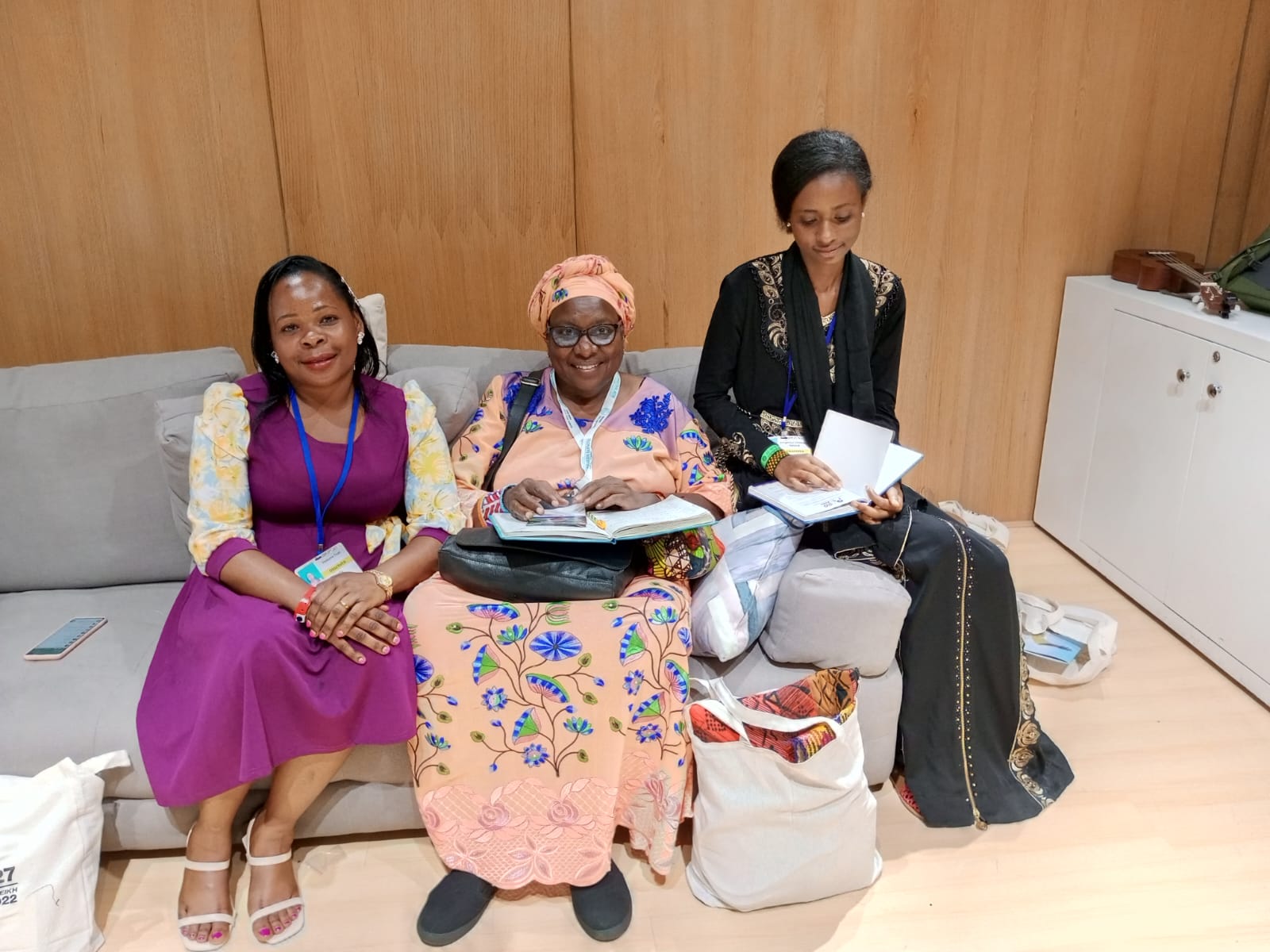 At the Indigenous Peoples Pavilion at COP 27, Aisatou learns from Lucy and Silvia (Bates Uganda) on the day’s priority sessions and messages 