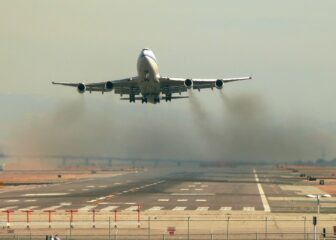 Jet taking off, spewing exhaust