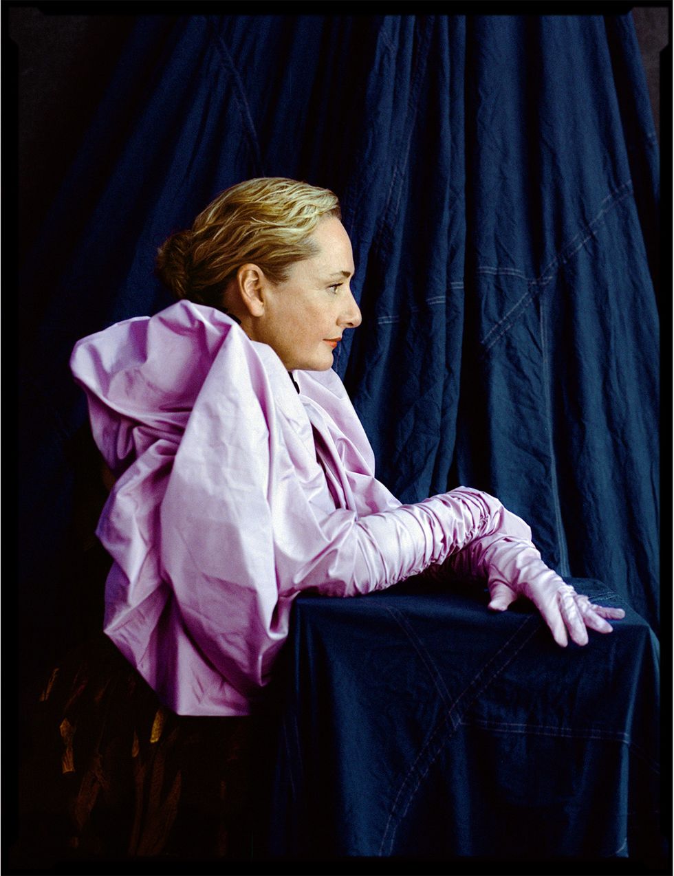a woman in a pink suit
