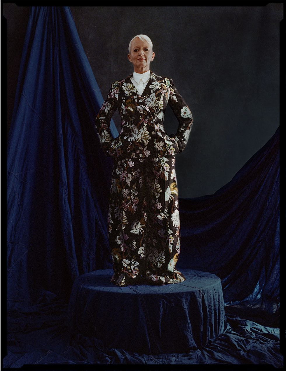 a person in a robe and a cape