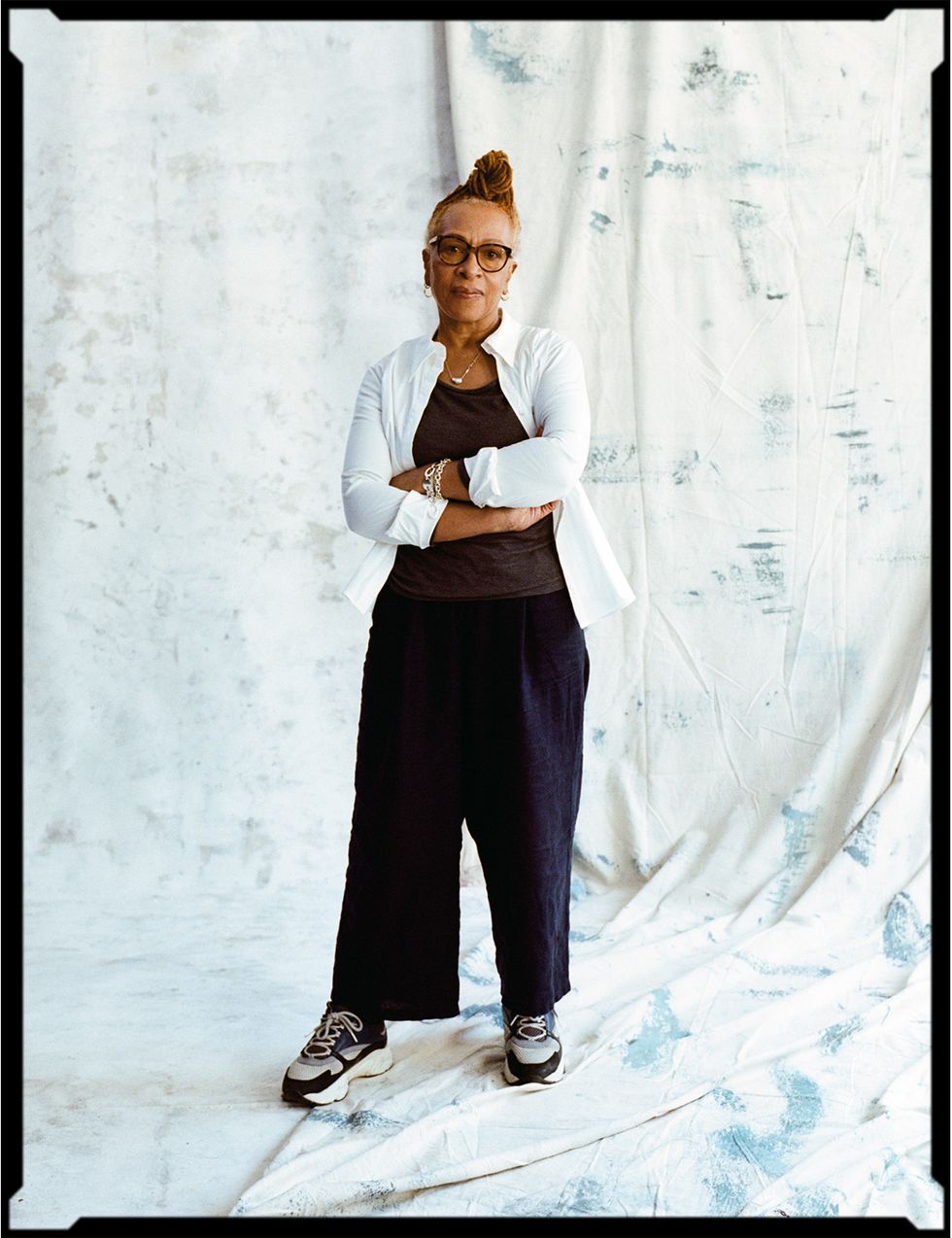 a person standing in front of a white wall