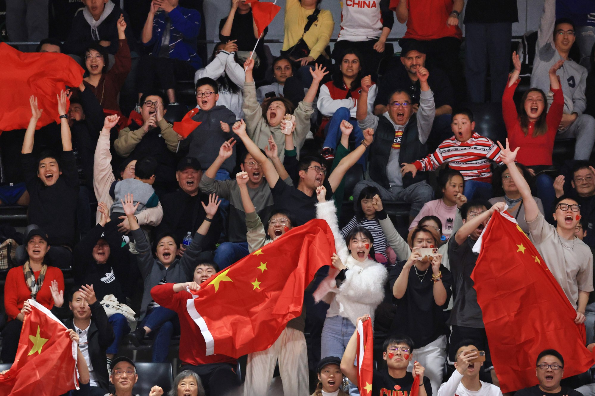 China fans celebrate victory in the FIBA Women’s Asia Cup final at Quaycentre in Sydney. Photo: EPA-EFE