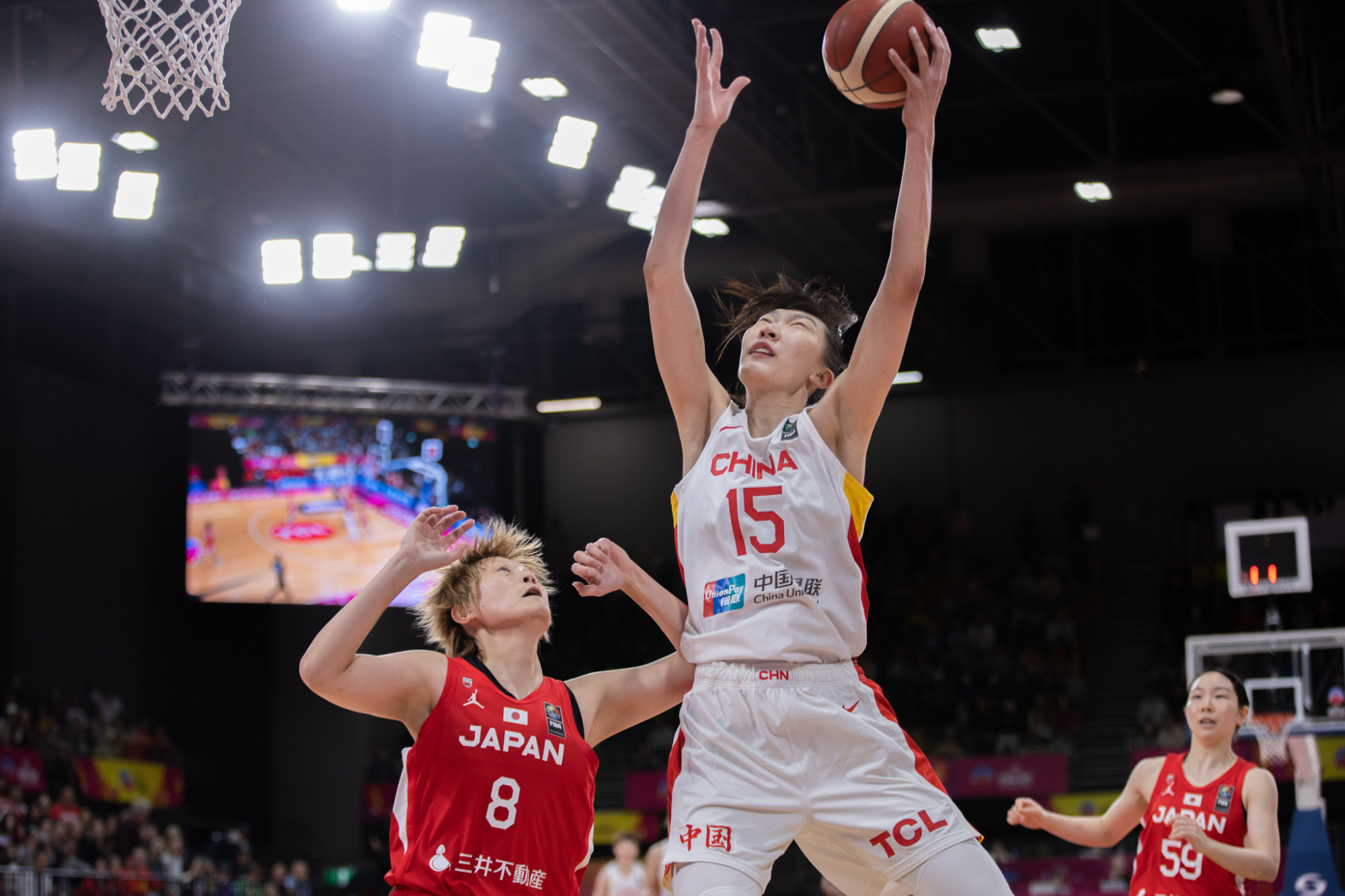 Han Xu of China goes for a lay-up during the final between China and Japan. Photo: Xinhua