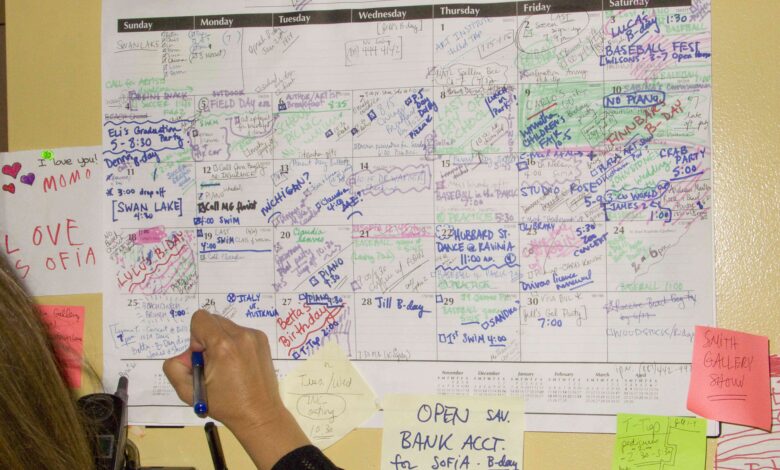 woman writing on full calendar aebbee.jpg